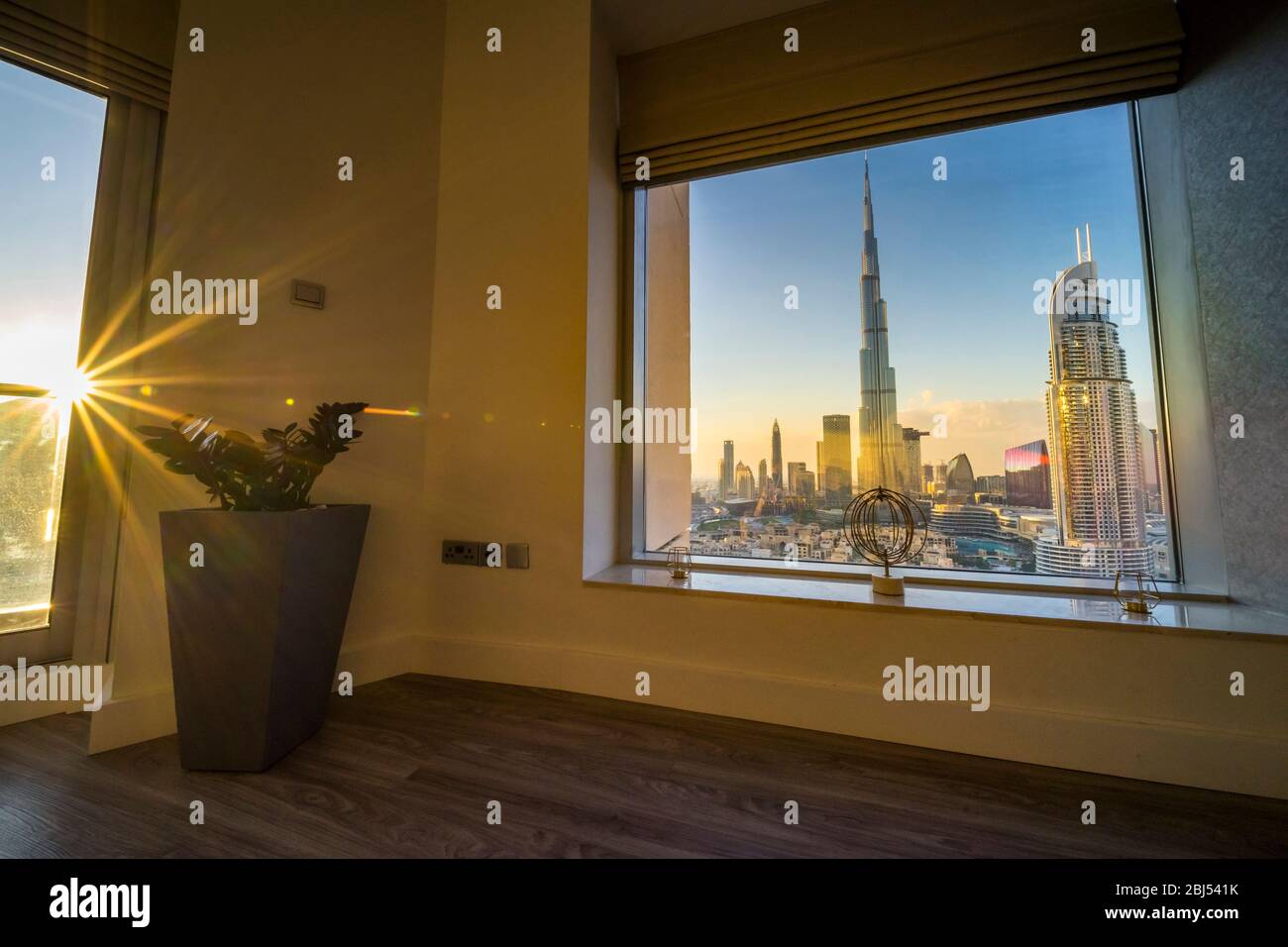 Light streaming into an elegant Dubai apartment with a view of the Burj