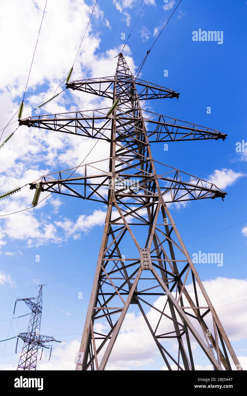 High-voltage electric tower on a background of blue sky. Power concept Stock Photo