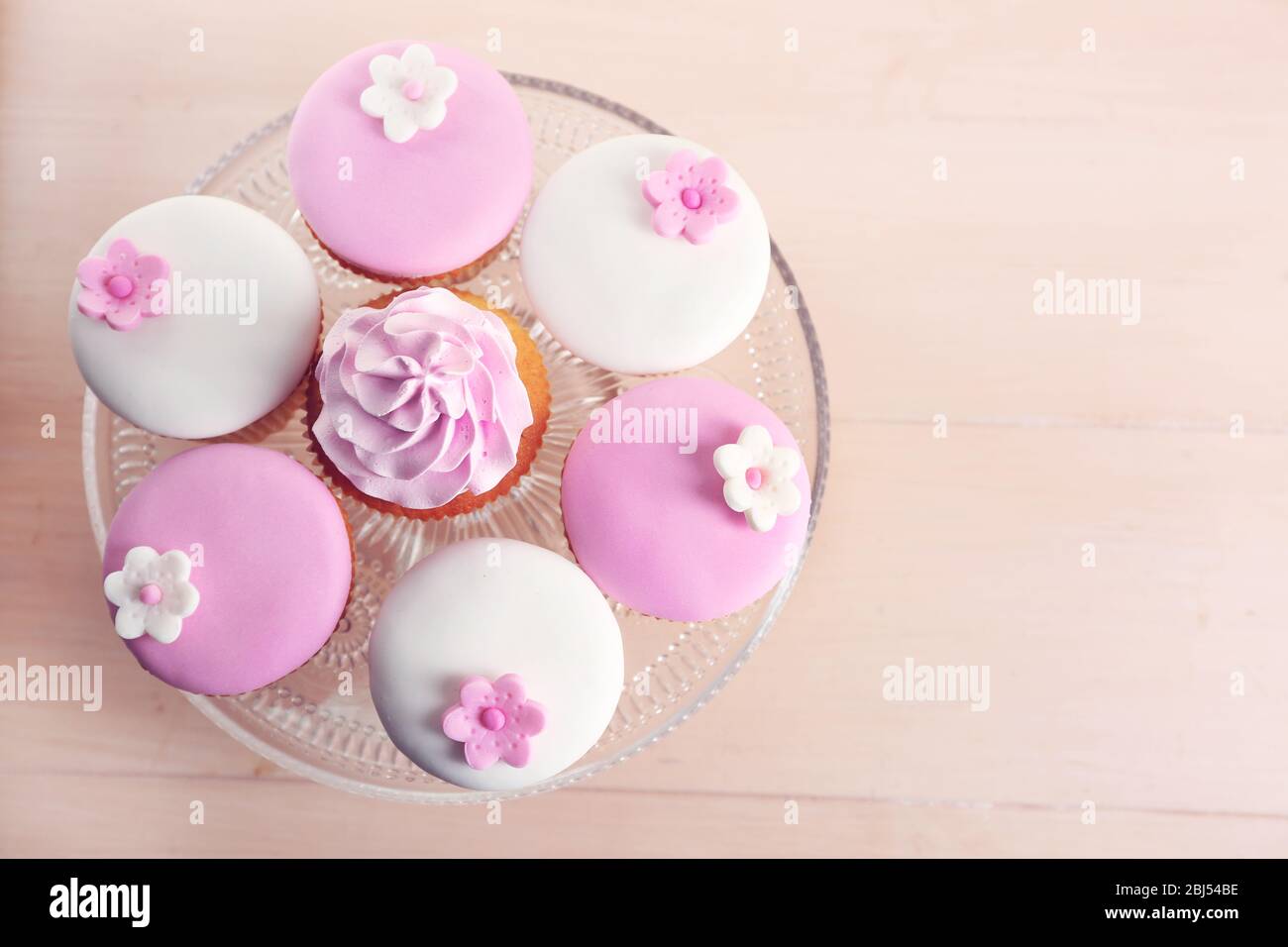 Tasty cupcake on stand, close-up Stock Photo