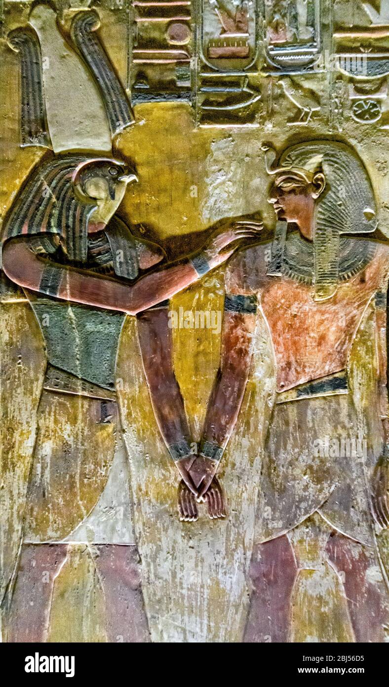 Scene from one of the Pillars in the Burial chamber of KV 17 showing deceased King Set I with Hawk Headed Horus-Son-of-Isis Stock Photo