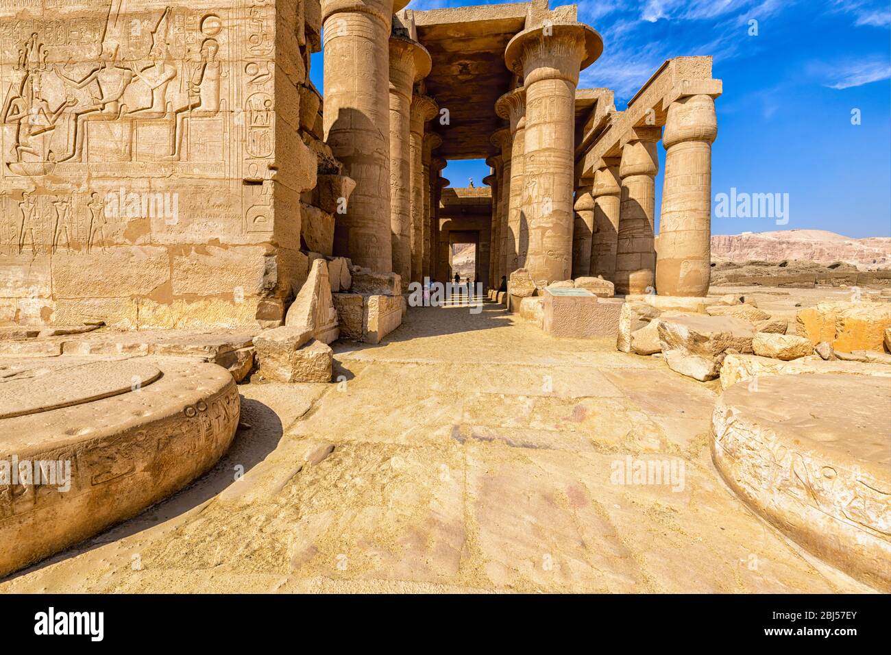 Relief of Rameses II in front of Amen-Ra, Mut and Khonsu at the entrance to Hypostyle Hall of the Ramesseum Stock Photo