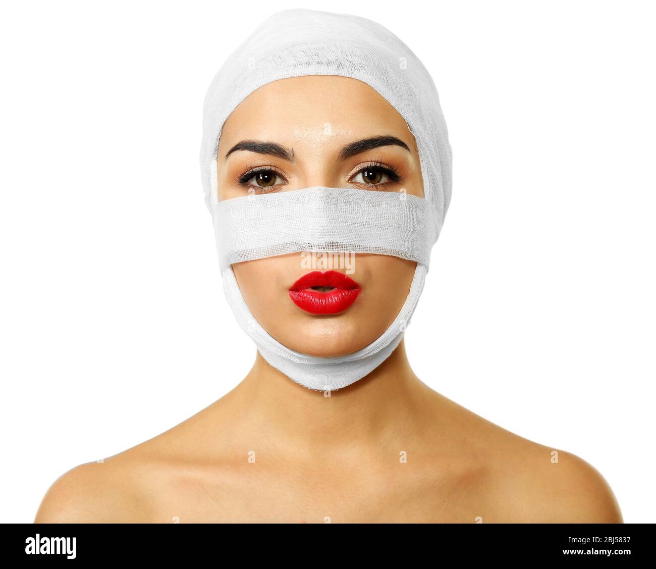 Young beautiful woman with a gauze bandage on her head and nose