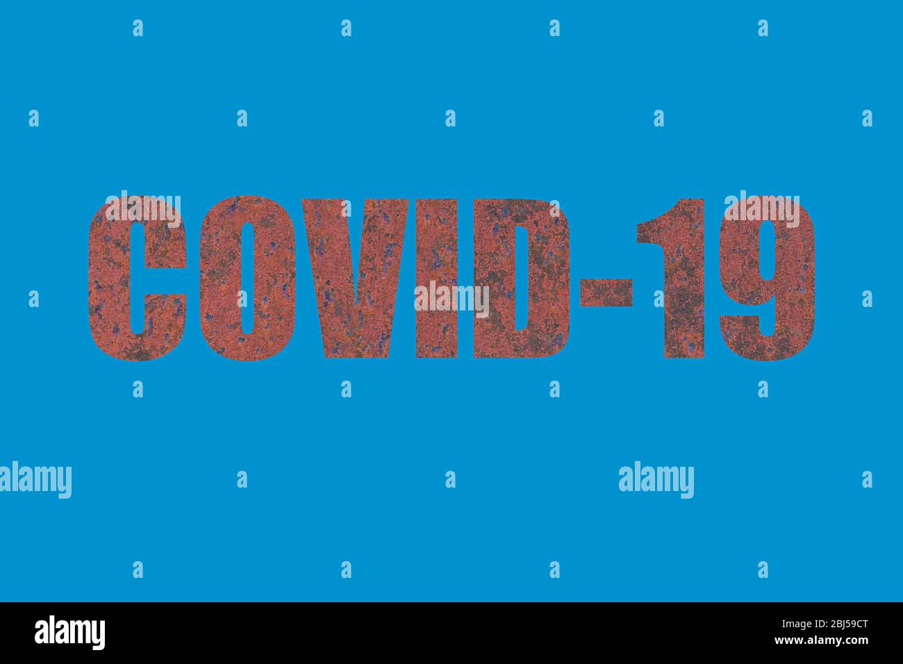 Inscription COVID-19 written of rusty texture on blue background. Coronavirus pandemic concept Stock Photo