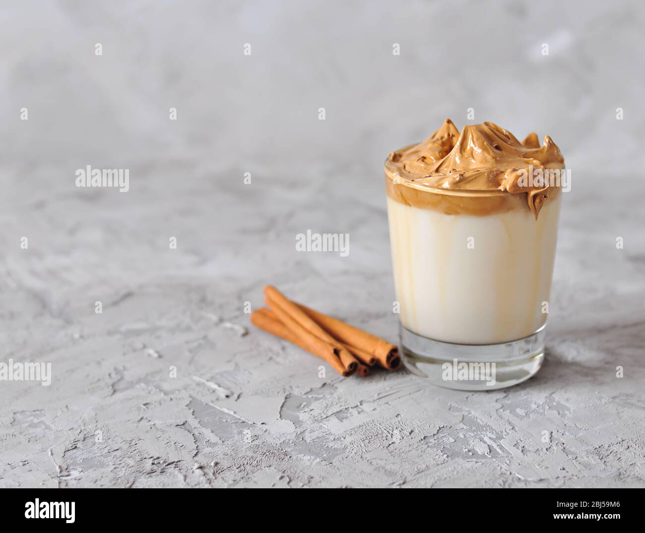 Homemade Dalgona coffee in glass . Recipe popular Korean drink latte with foam of instant coffee. Created new drink during Quarantine and self-isolati Stock Photo