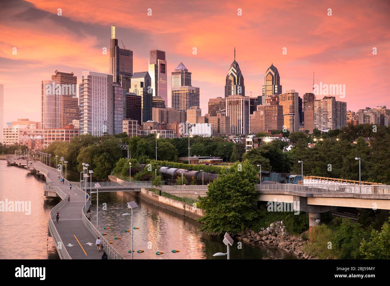 Downtown city skyline view of Philadelphia Pennsylvania USA over the Schuylkill River and boardwalk Stock Photo