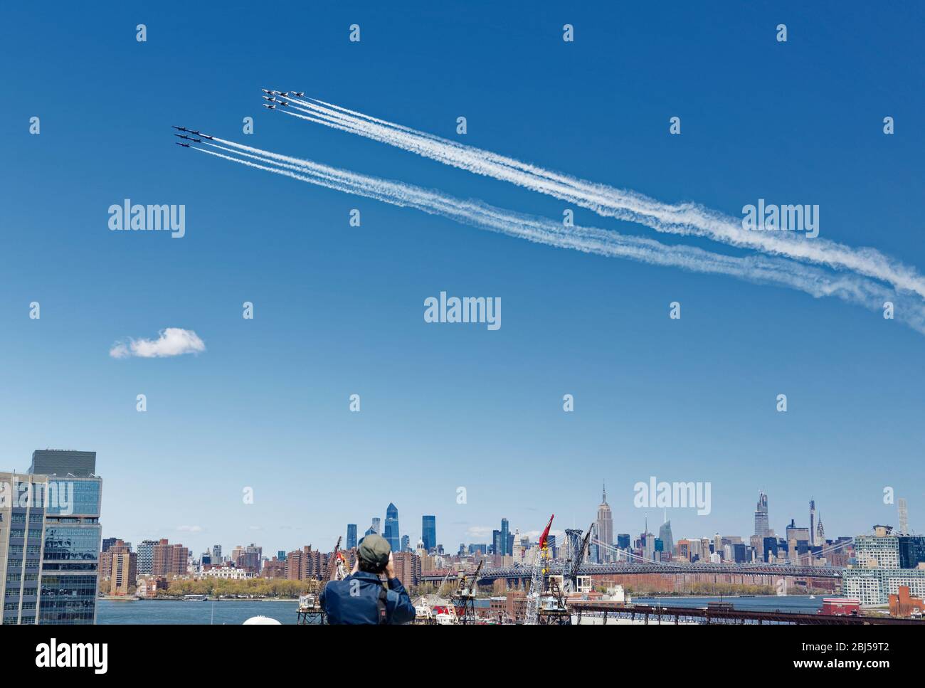 The USA Air Force and Navy elite flying squads together do a flyover in NYC to show support to the front line healthcare workers fighting covid-19 Stock Photo