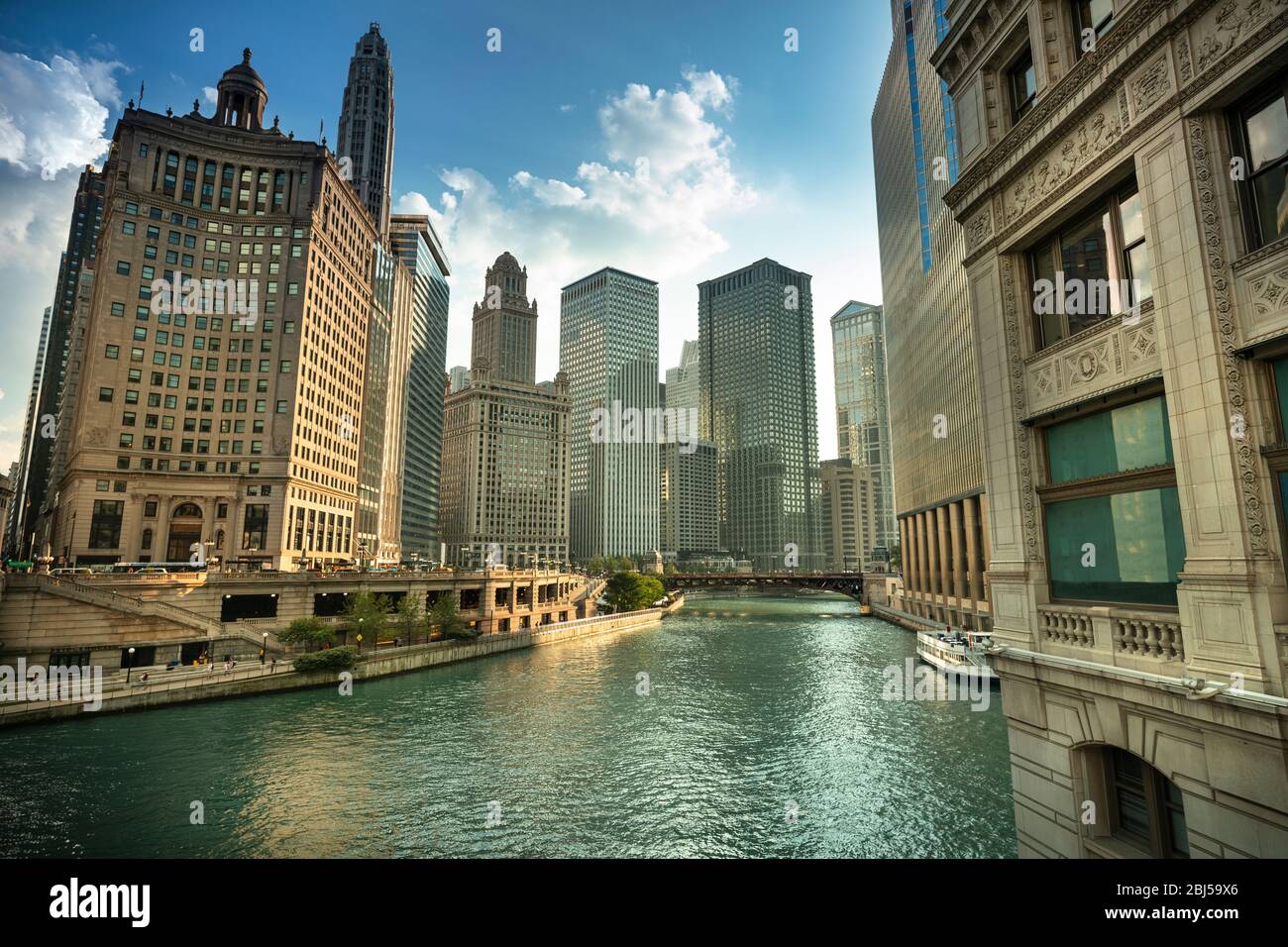 City buildings and skyline over the boats on the Chicago River Illinois ...
