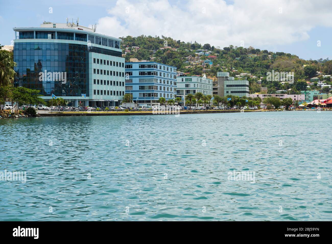 The waterfront in Castries, with multi-story buildings, and  no ships present due to the corona virus Stock Photo