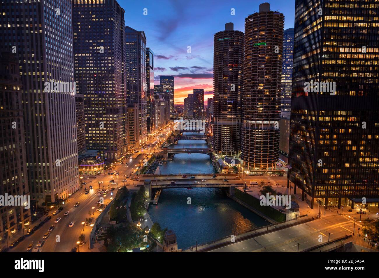 Downtown city buildings and skyline over the Chicago River Illinois USA ...