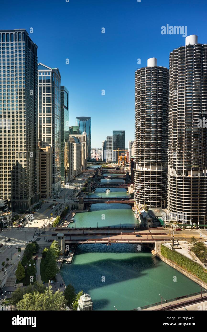 Downtown city buildings and skyline over the Chicago River Illinois USA ...