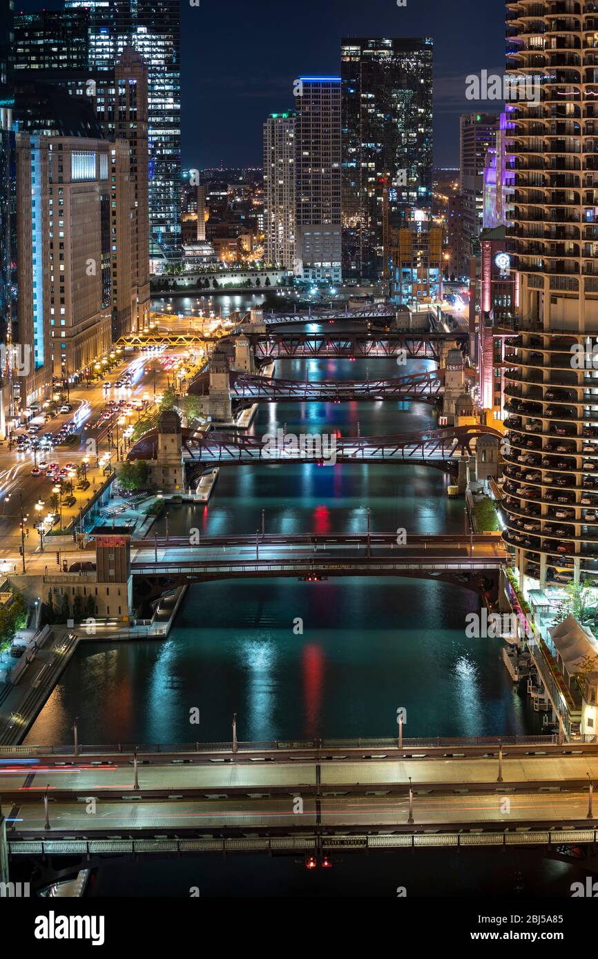 Downtown city buildings and skyline over the Chicago River Illinois USA ...
