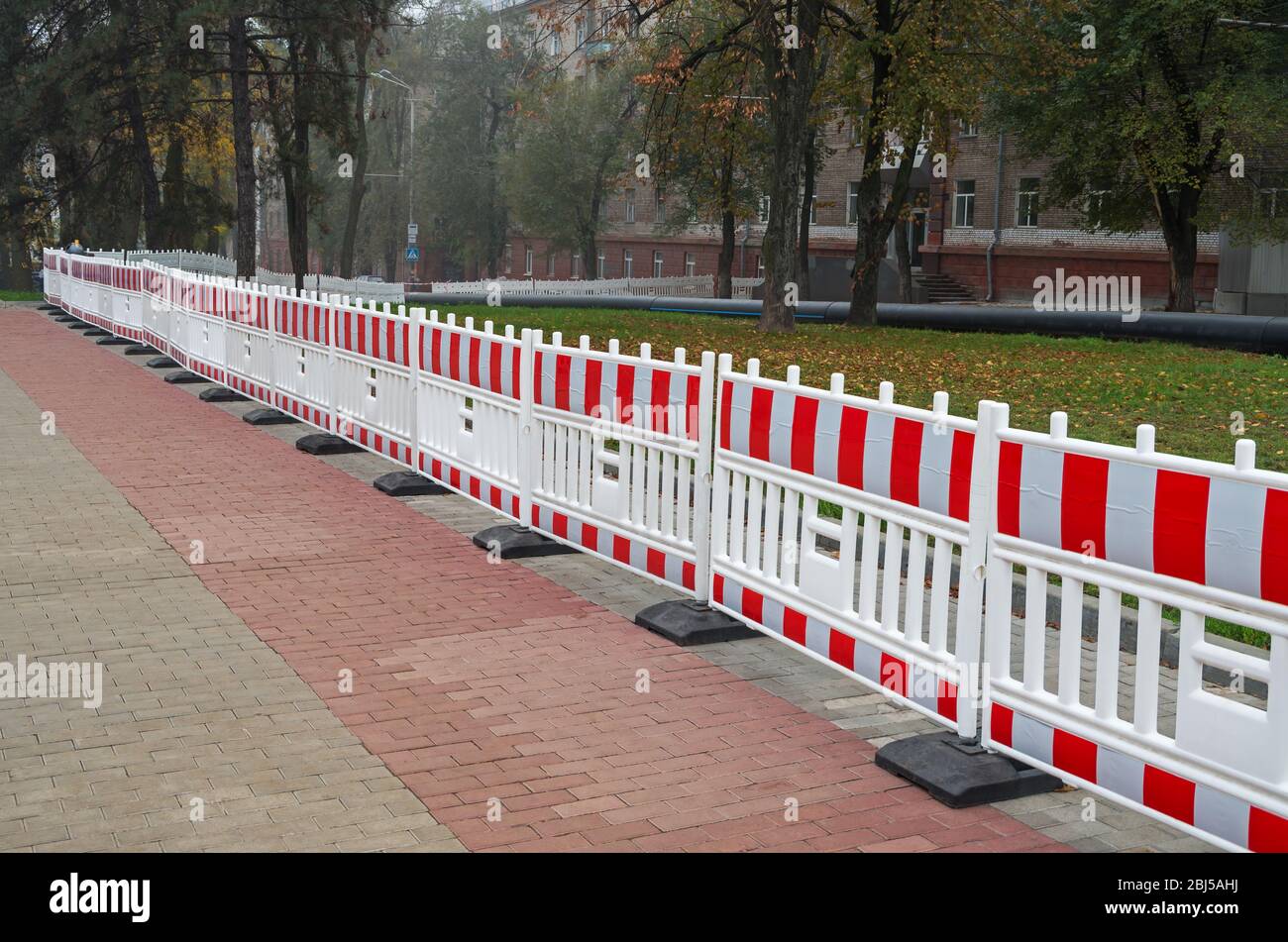 Plastic portable barrier or fencing hazardous areas for pedestrians and