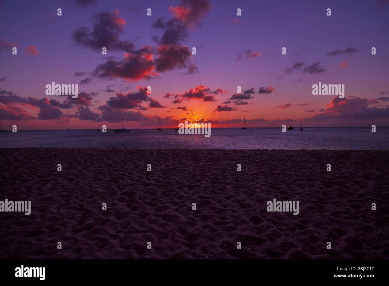 calming scene with the fading light of the sun at a tropical beach Stock Photo