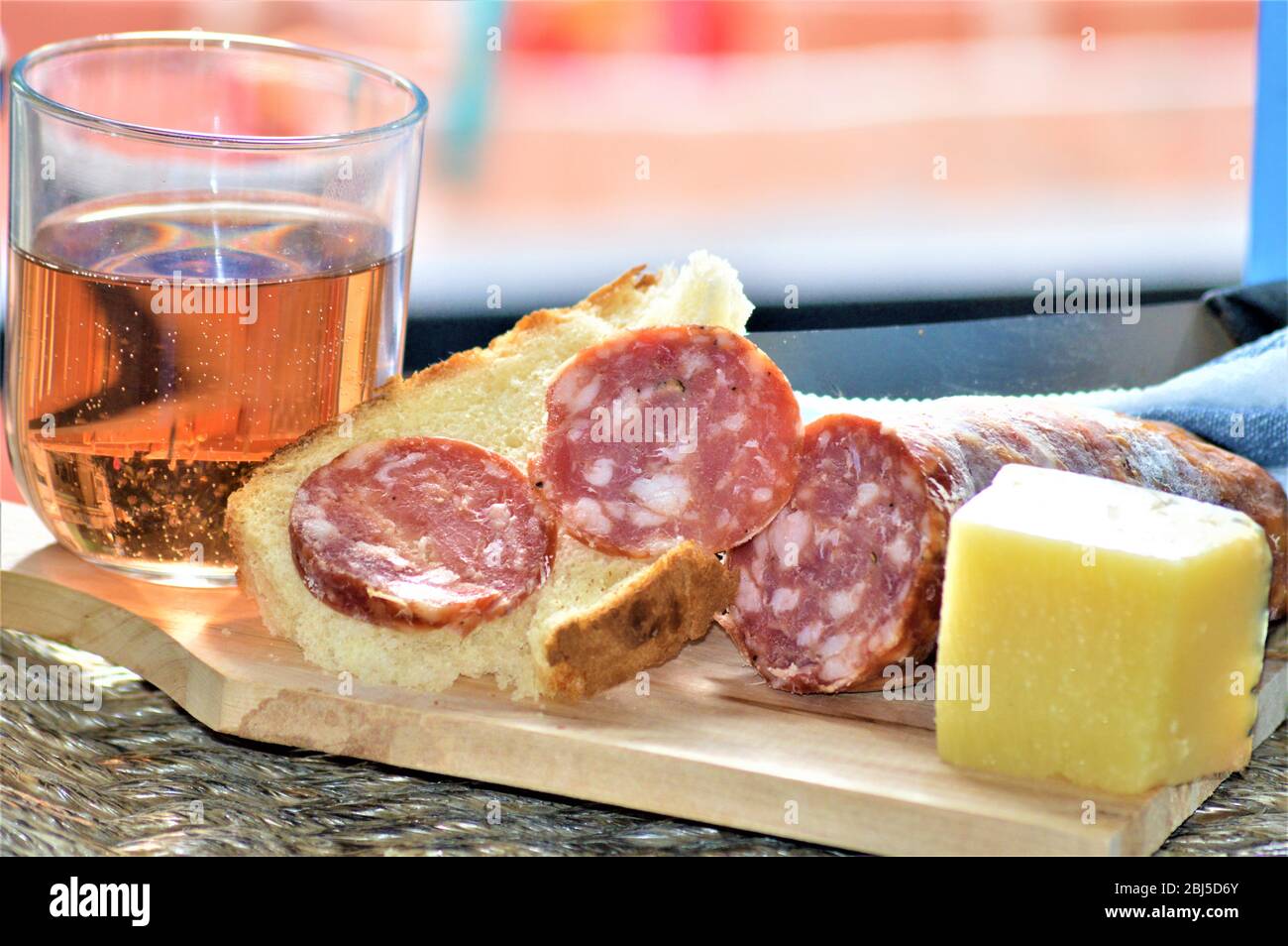italian picnic food with salami sausage pork cheese wine bread Stock