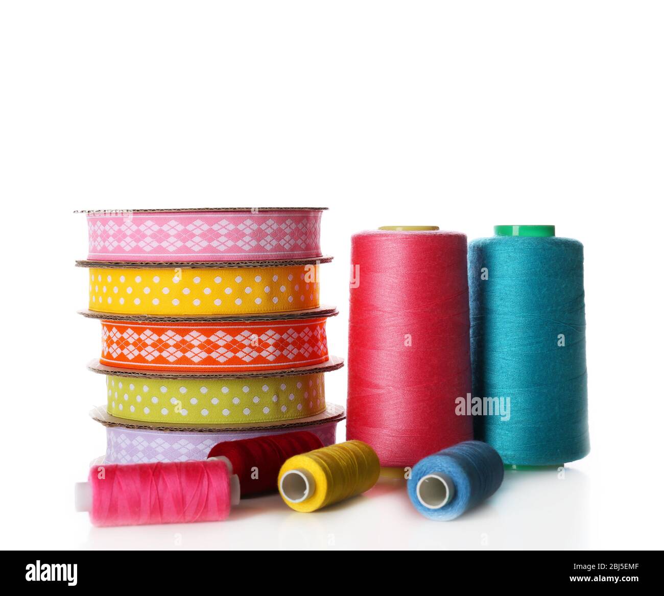 Spools of color ribbon and thread, isolated on white Stock Photo - Alamy