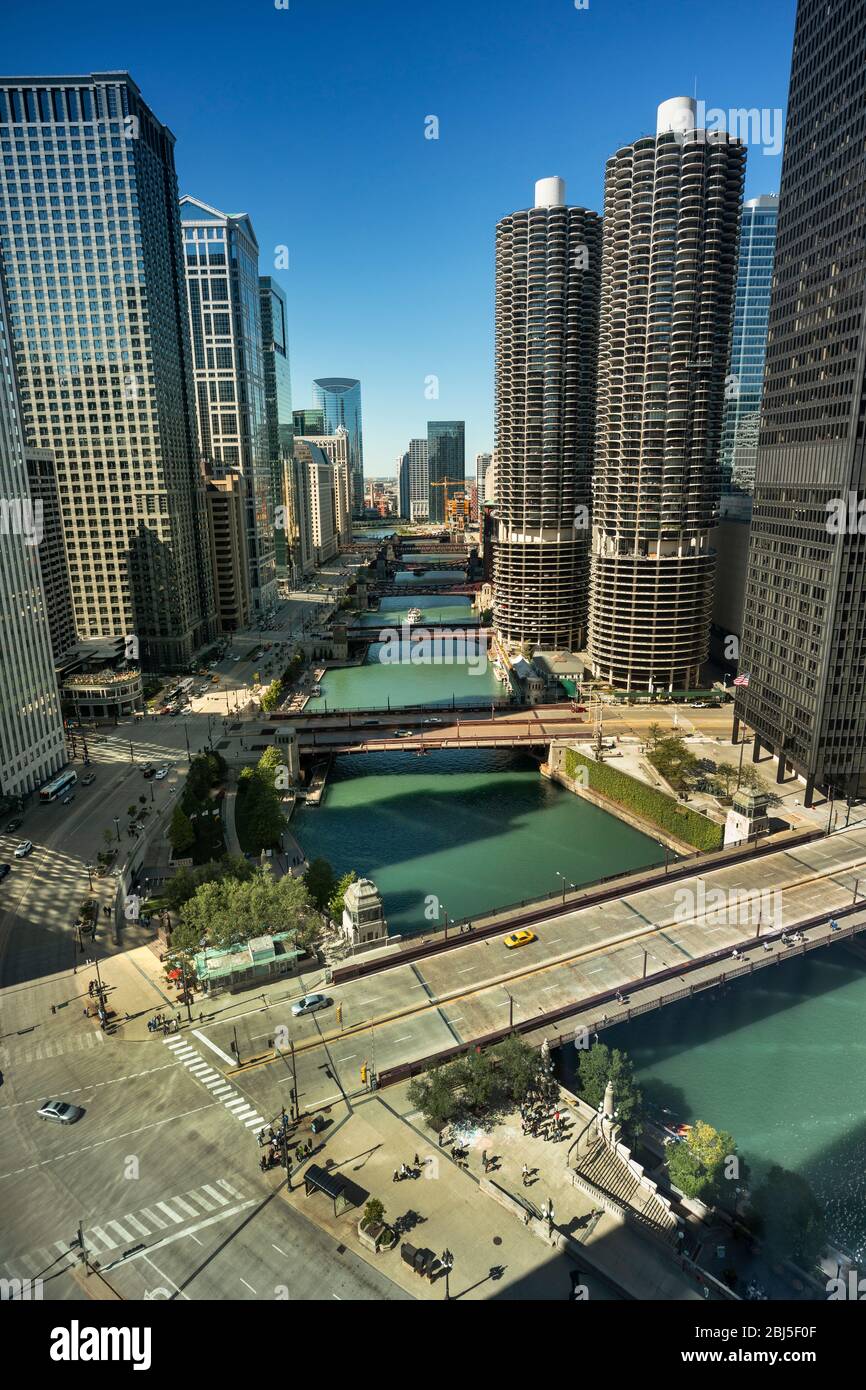 Downtown city buildings and skyline over the Chicago River Illinois USA ...
