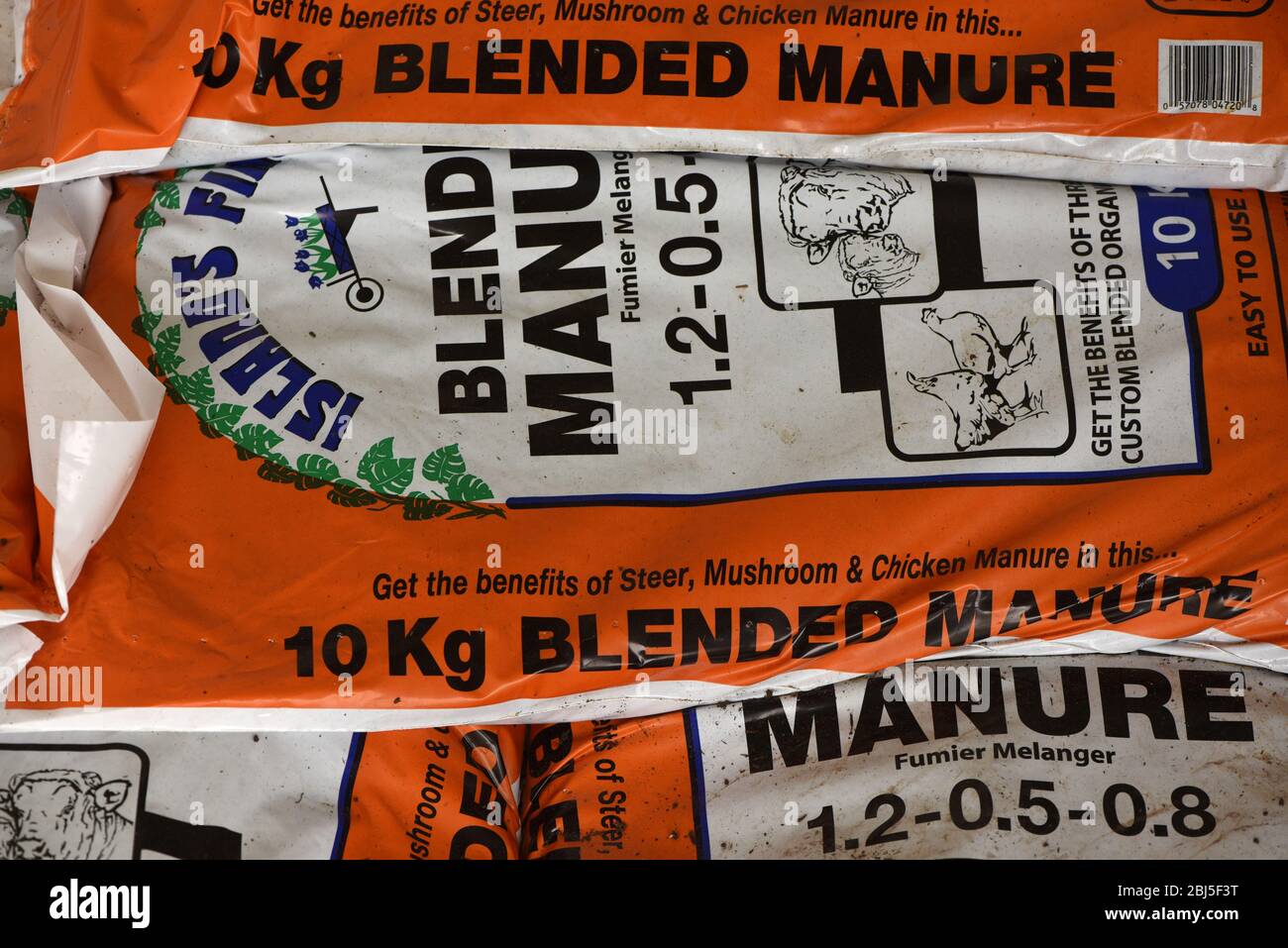 Bags of blended manure for sale as fertilizer for gardens Stock Photo