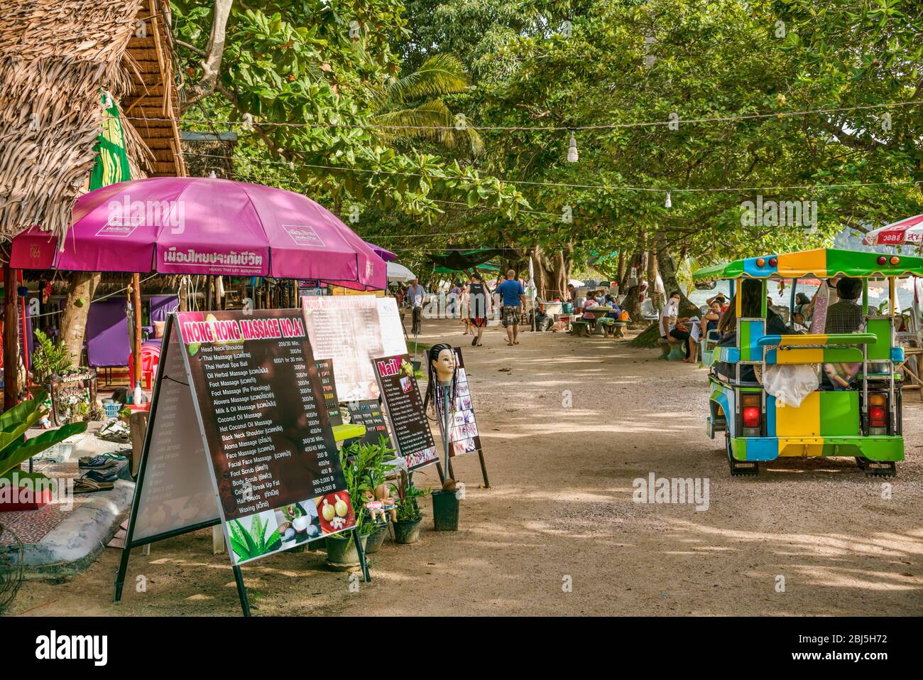 Busy Shopping Street and Thai Massage Parlor at Ao Nang Beach, Thailand Stock Photo