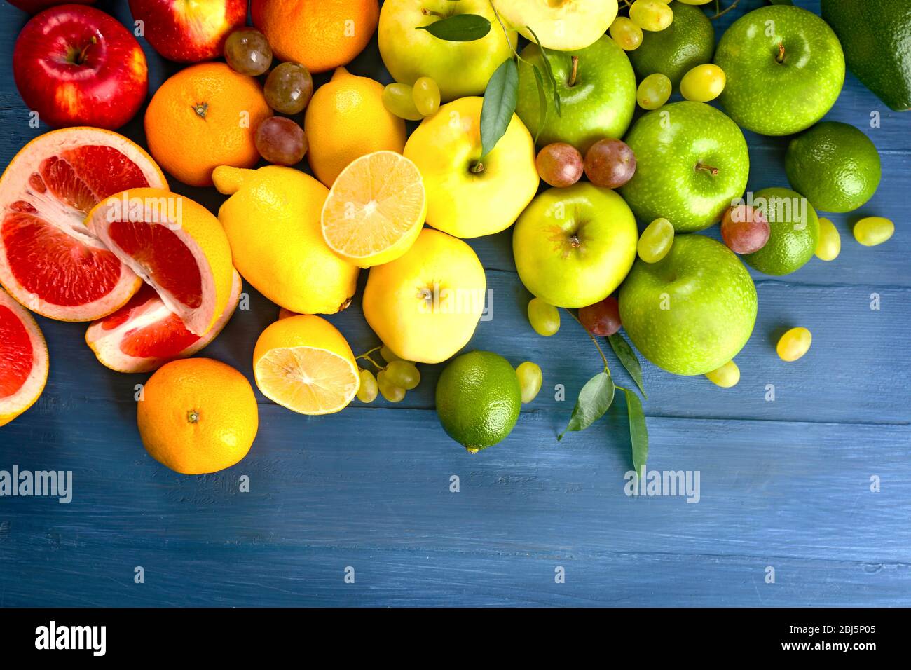 Fruits on dark blue wooden background Stock Photo