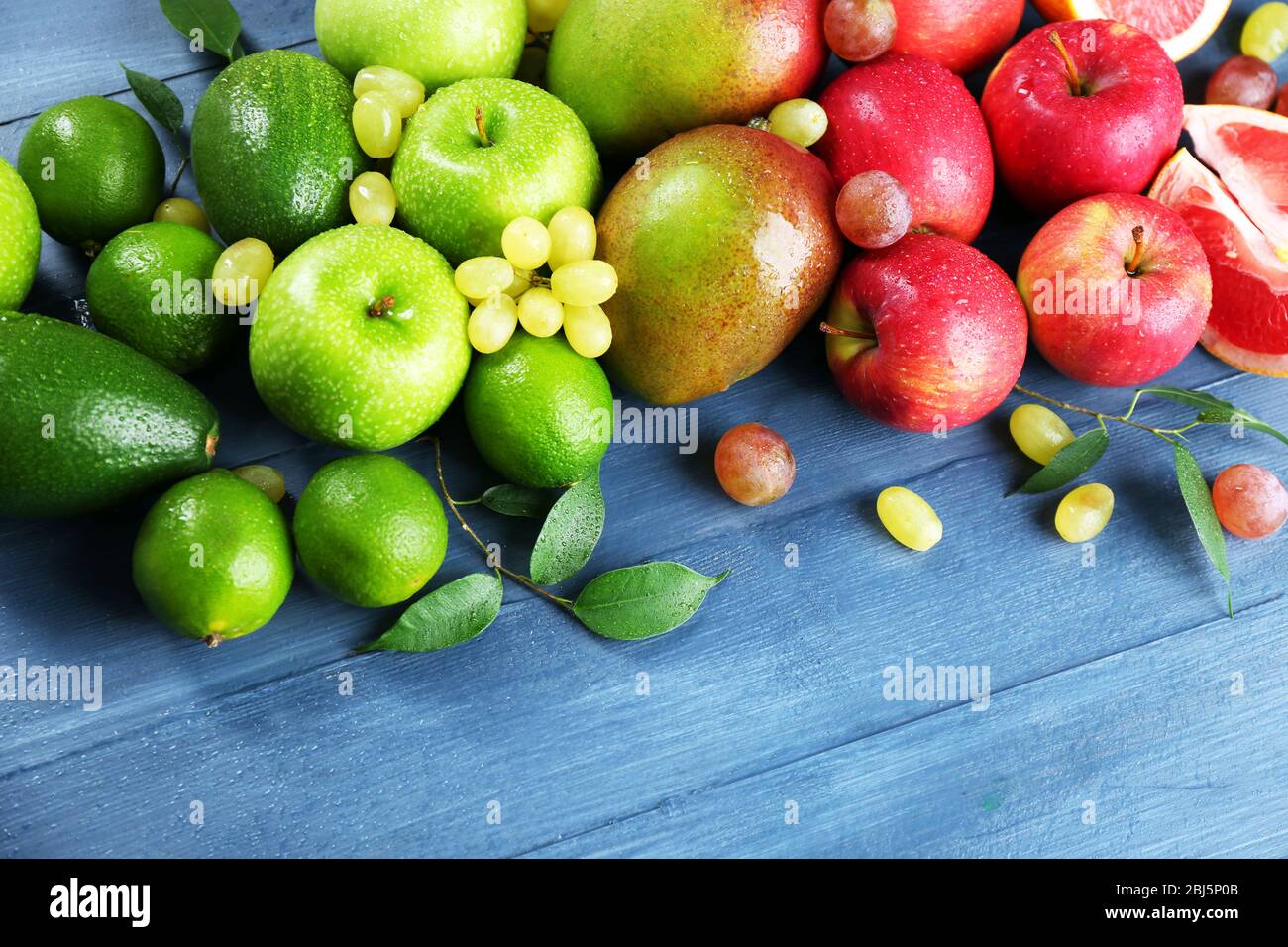 Fruits on dark blue wooden background Stock Photo