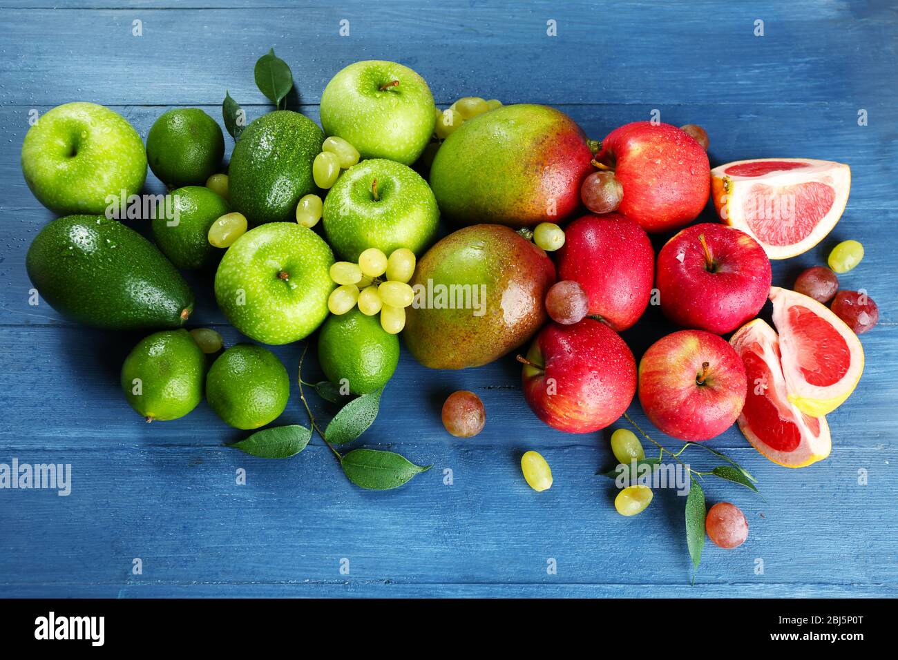 Fruits on dark blue wooden background Stock Photo