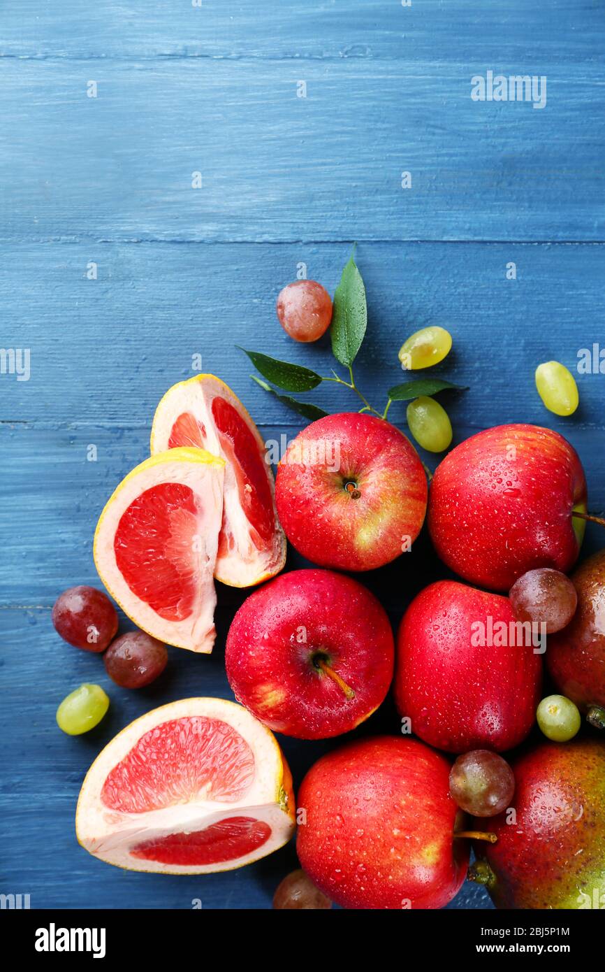Fruits on dark blue wooden background Stock Photo