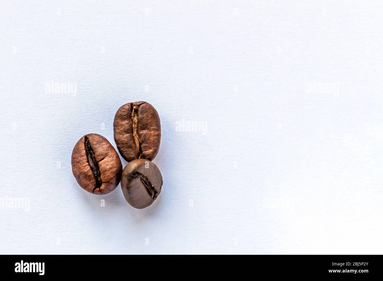 coffee beans on a light background. roasted coffee bean Stock Photo - Alamy