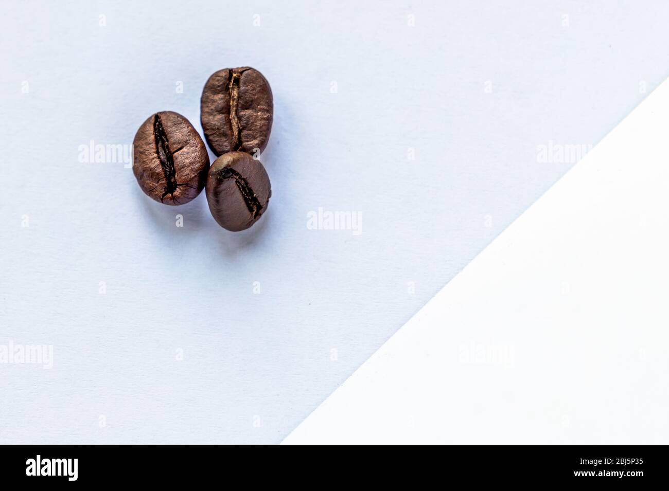 coffee beans on a light background. roasted coffee bean Stock Photo - Alamy