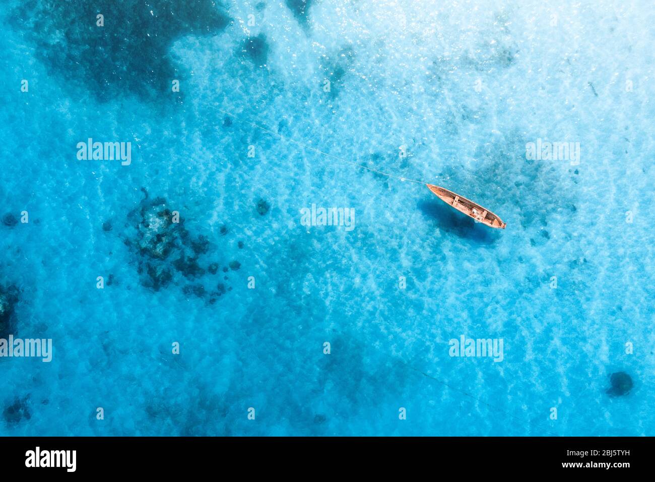 Aerial view of the fishing boat in transparent blue water Stock Photo ...