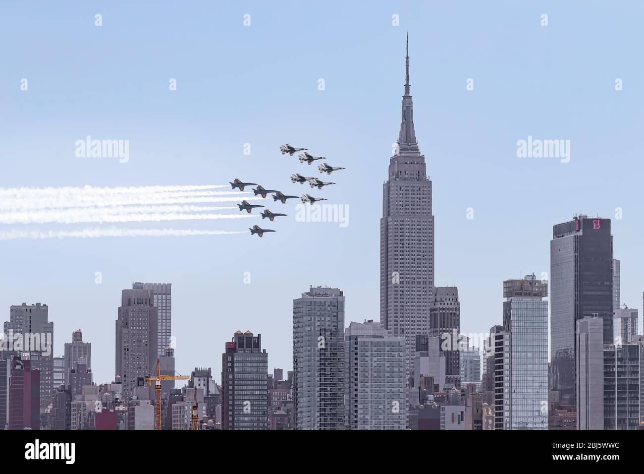 NYC Salute To  Heros - US Navy Blue Angels and the US Air Force Thunderbirds fly by over New York City saluting the frontline first responders. Stock Photo