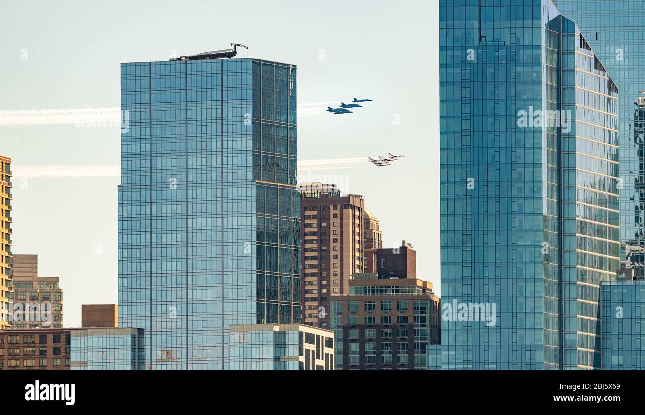 NEW YORK, USA - APR 28, 2020: Blue Angel and Thunder Bird formation fly over New York City to pay tribute to frontline responders and hospital workers Stock Photo