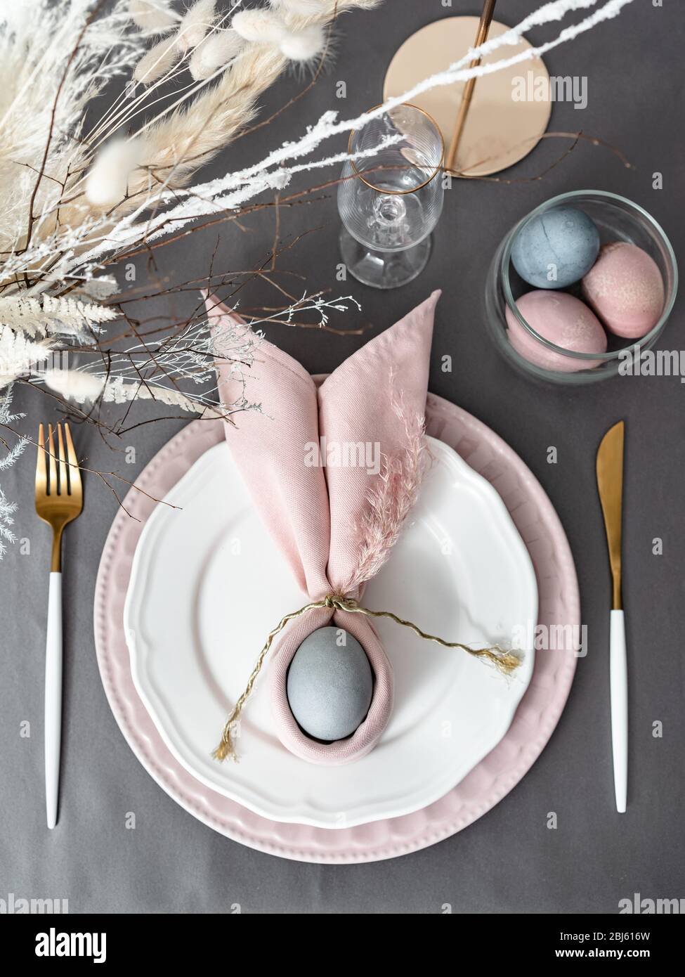Setting easter table with colored eggs Stock Photo