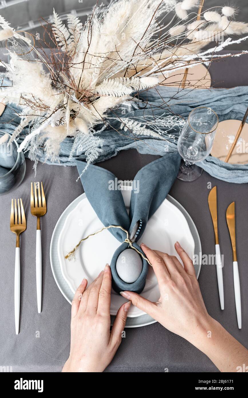 Setting easter table with colored eggs Stock Photo