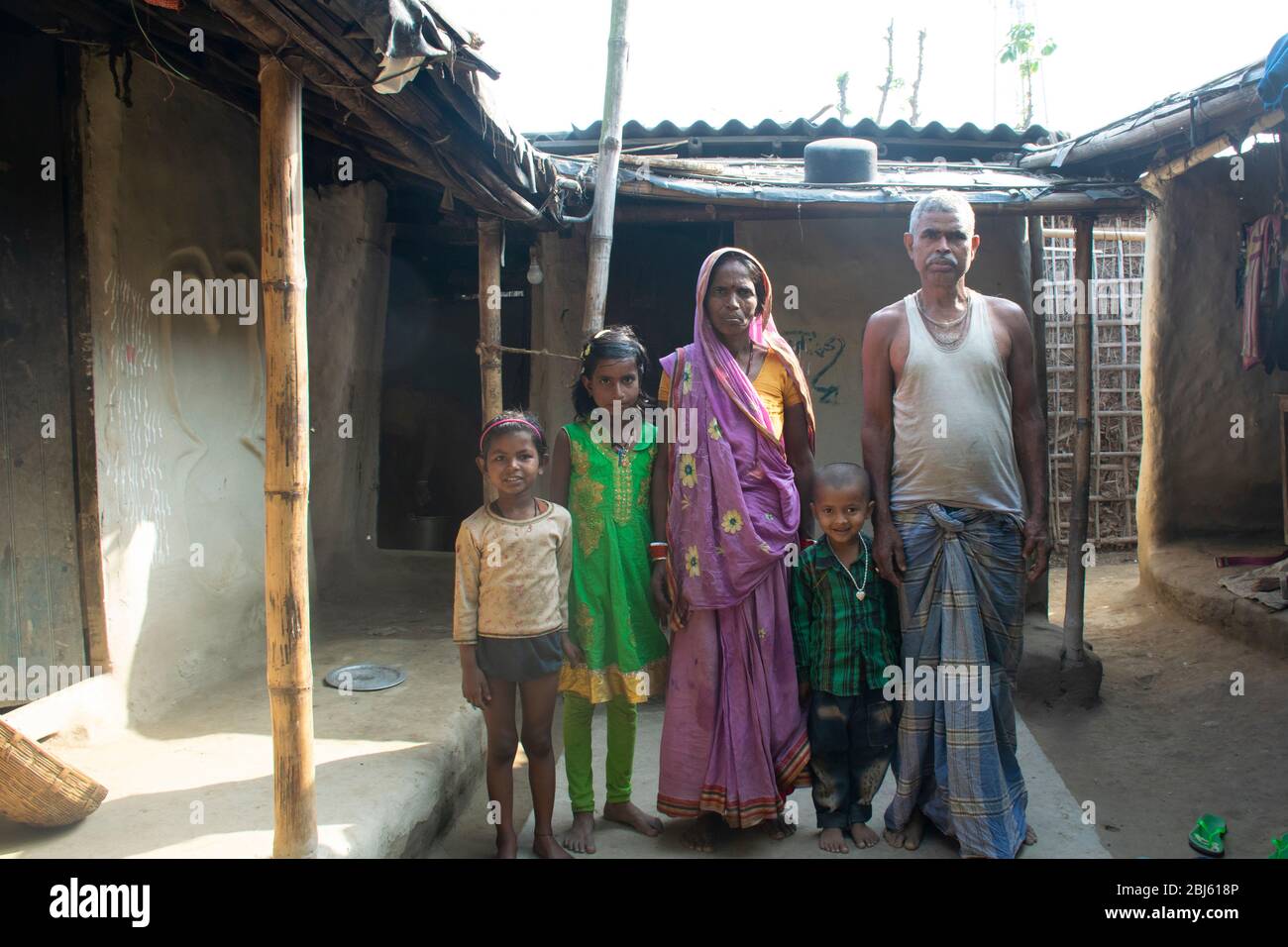 Poor Indian family in front of their house, Bihar, India Stock Photo