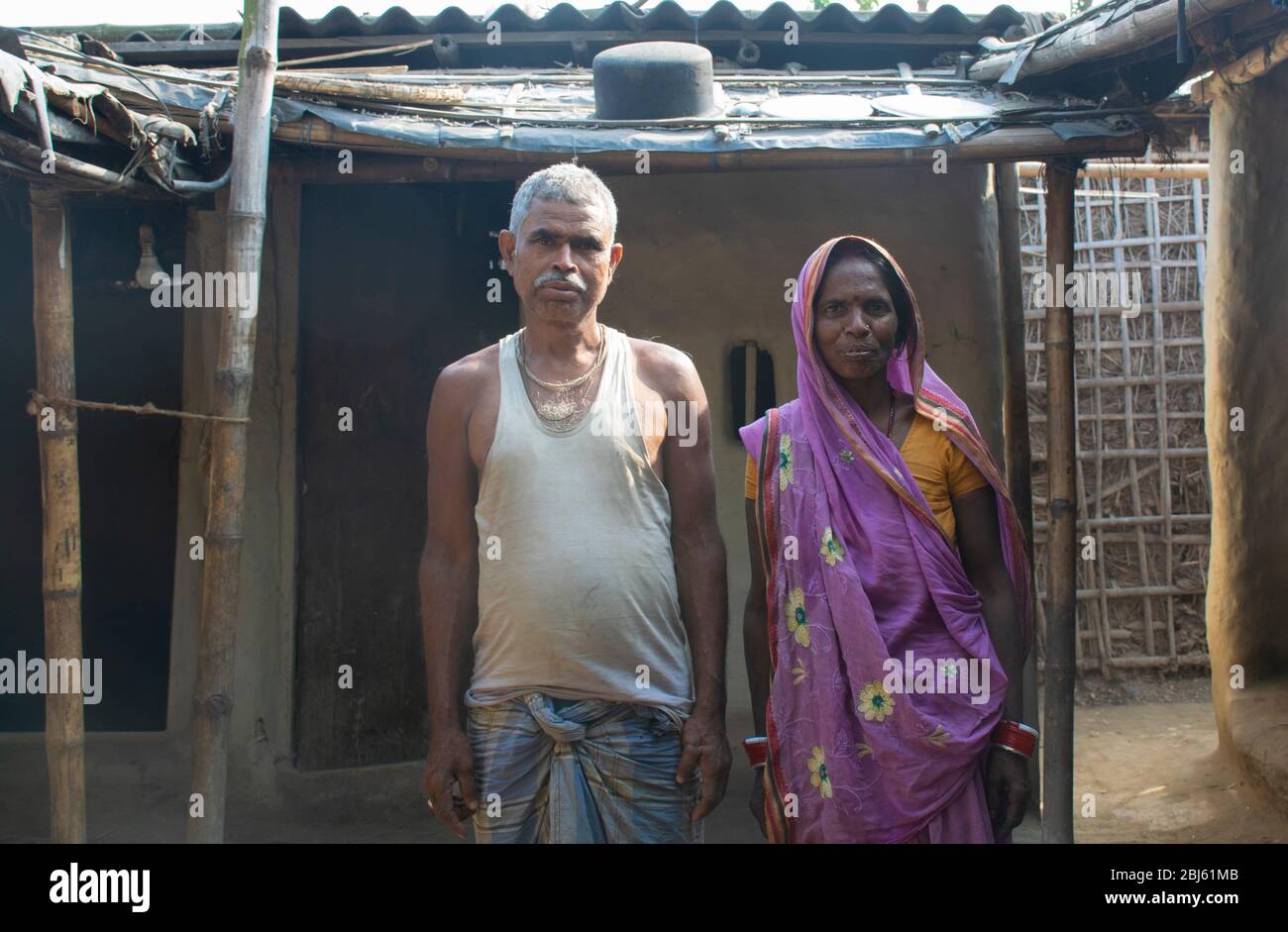 Poor Indian family in front of their house, Bihar, India Stock Photo