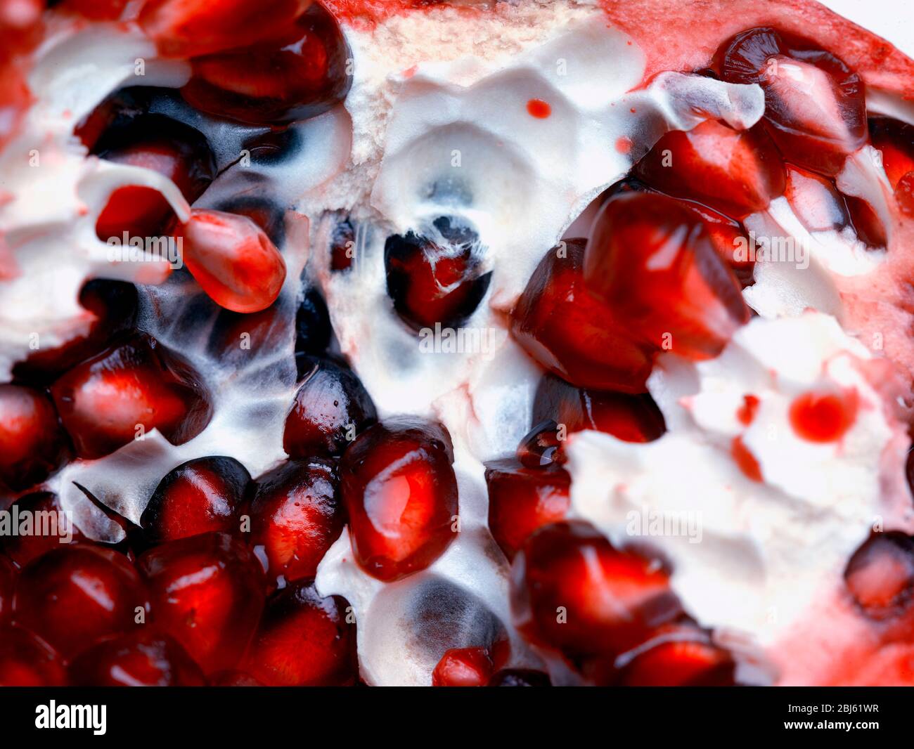 Still-life of Pomegranate and seeds depiction, natural fruit portrait Stock Photo