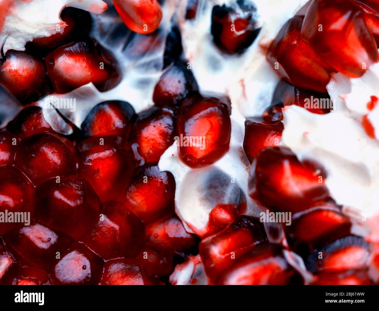 Still-life of Pomegranate and seeds depiction, natural fruit portrait Stock Photo