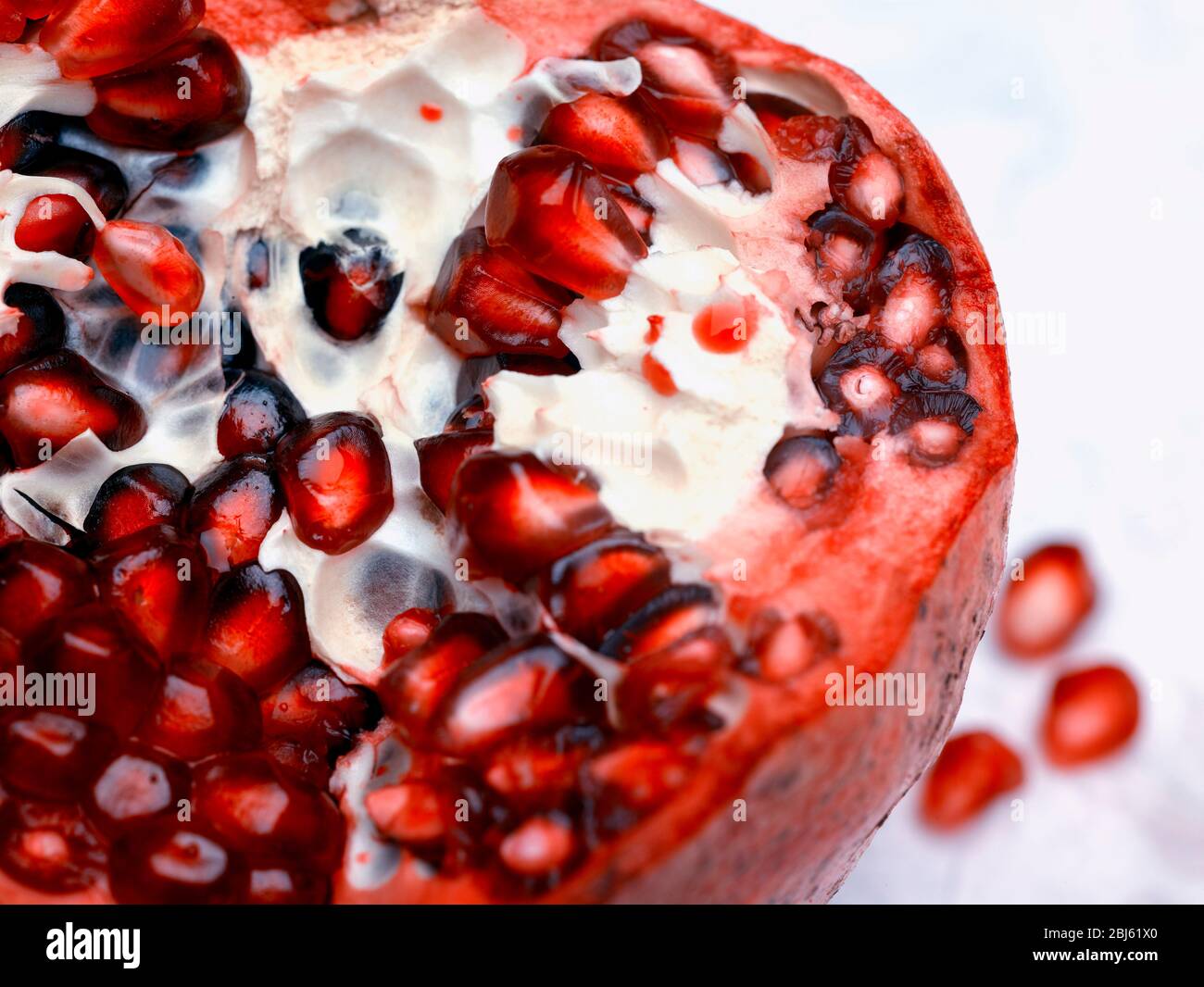 Still-life of Pomegranate and seeds depiction, natural fruit portrait Stock Photo