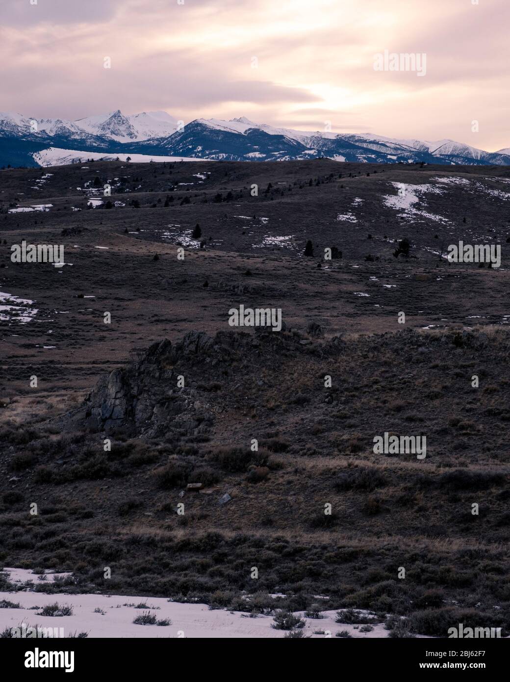 Winter unset over fields in the mountains Stock Photo