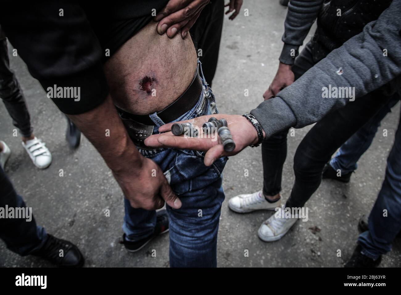 Tripoli, Lebanon, 28 April 2020. Protesters show rubber bullets and an injury collected during riots that broke out following the death of a protestor shot by the army during protests the previous night. Elizabeth Fitt Credit: Elizabeth Fitt/Alamy Live News Stock Photo