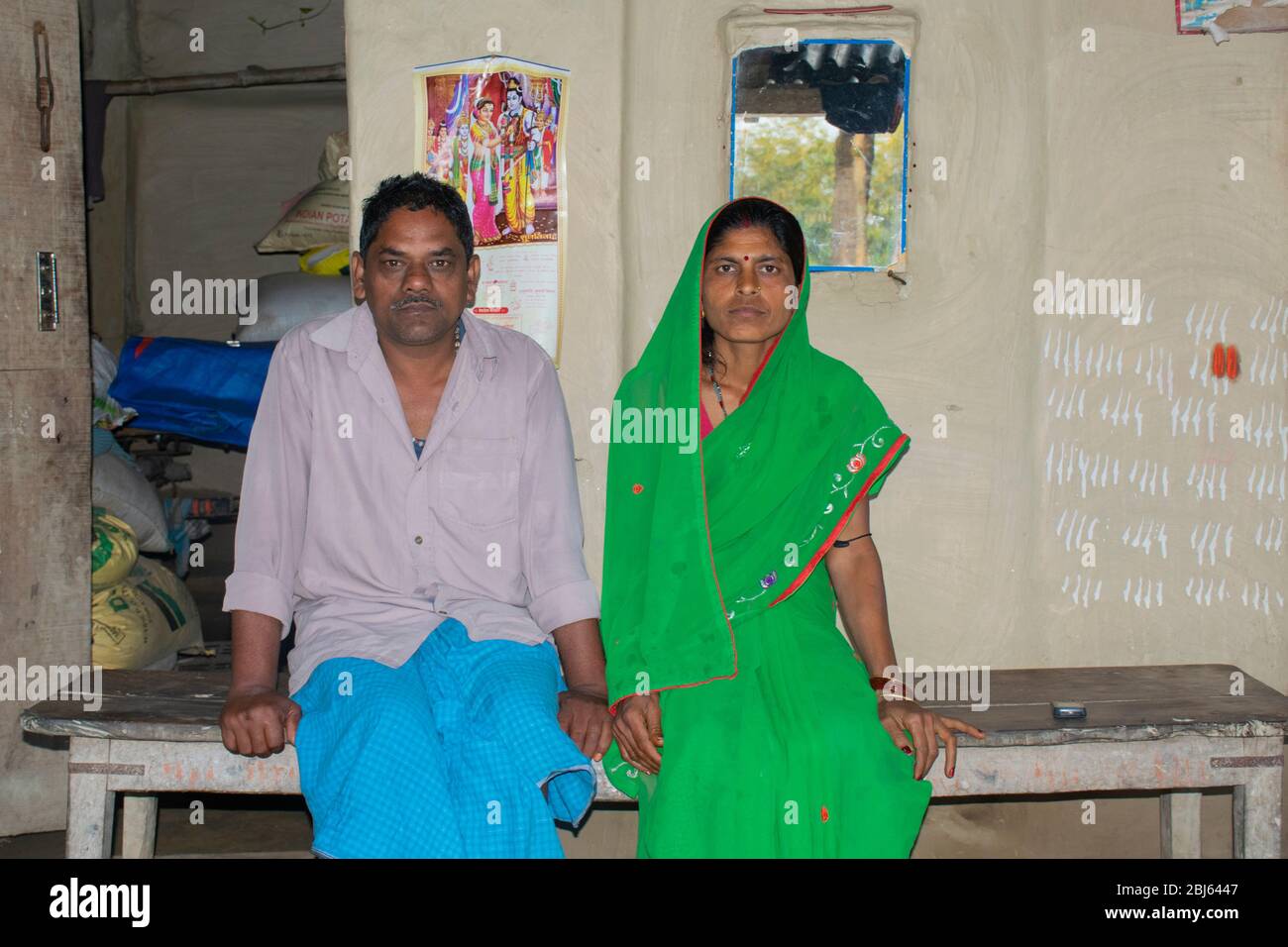 Indian couple sitting on bench hi-res stock photography and images - Alamy