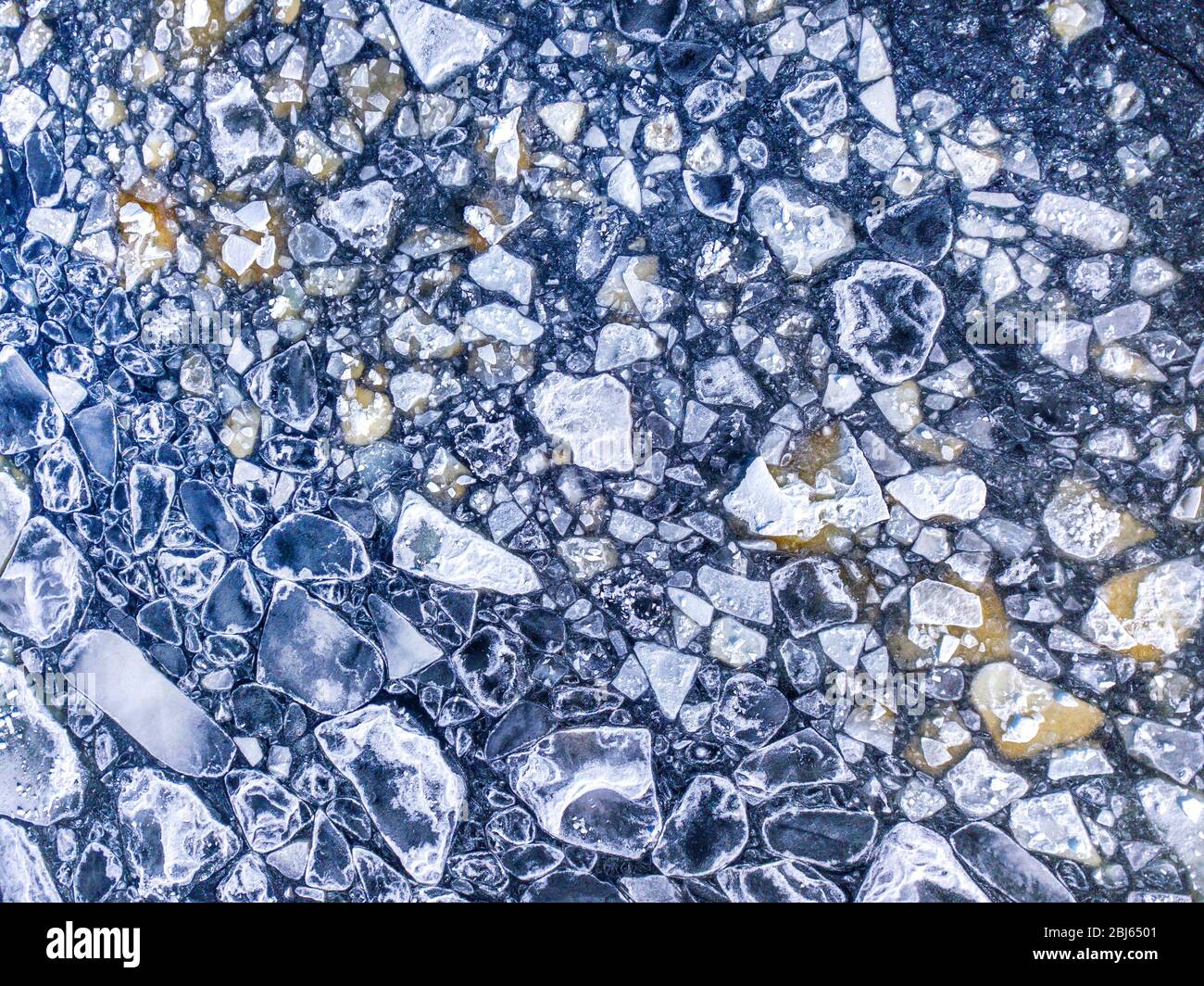 Aerial view of the ice texture broken into pieces of different shapes ...