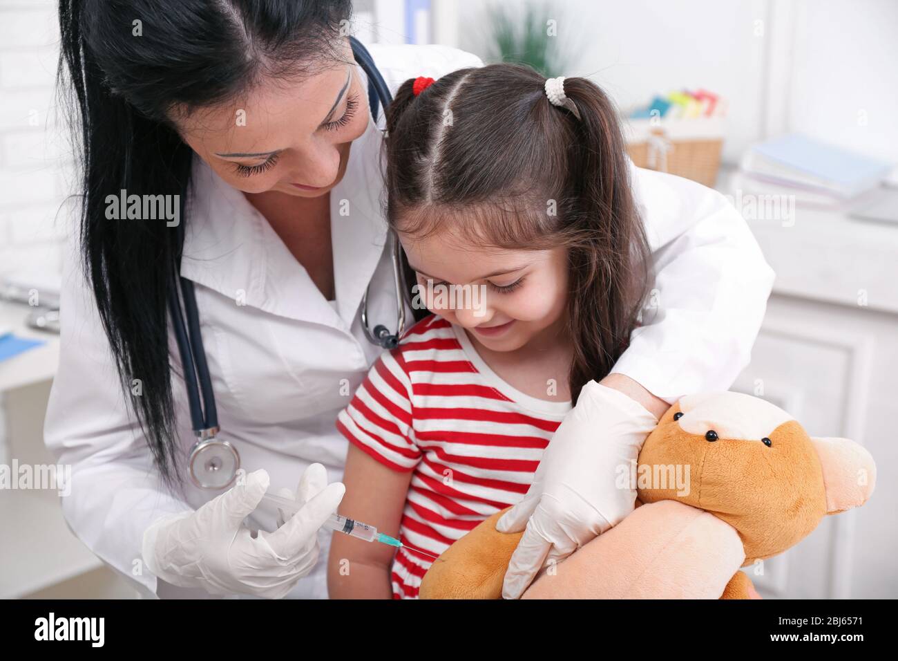 Friendly doctor working giving hi-res stock photography and images - Alamy