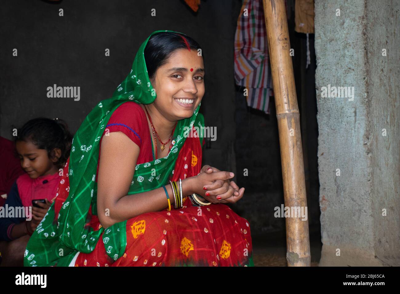 indian woman wearing sari sitting and smile Stock Photo - Alamy