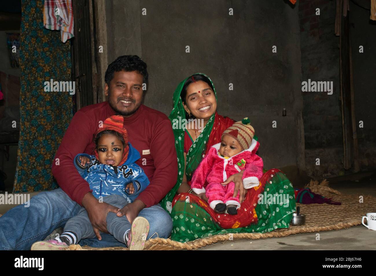 Portrait of Indian rural family smiling Stock Photo
