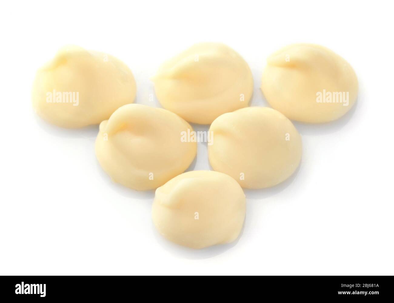 White chocolate morsels isolated on white Stock Photo Alamy