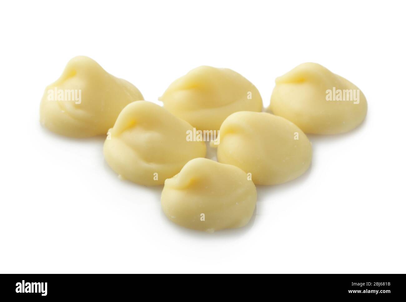 White chocolate morsels isolated on white Stock Photo Alamy