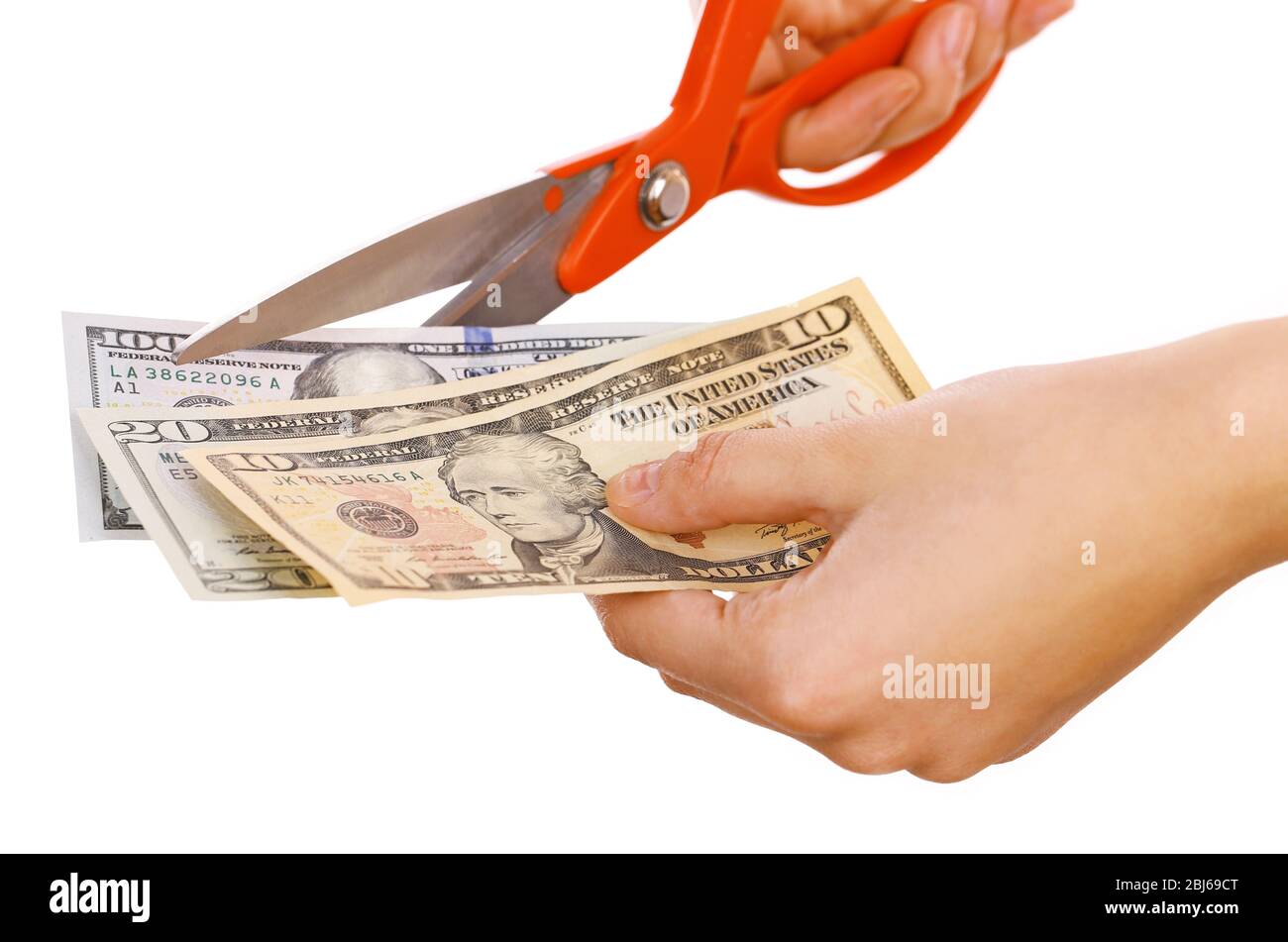 Hands with scissors cutting dollar banknotes, isolated on white Stock ...