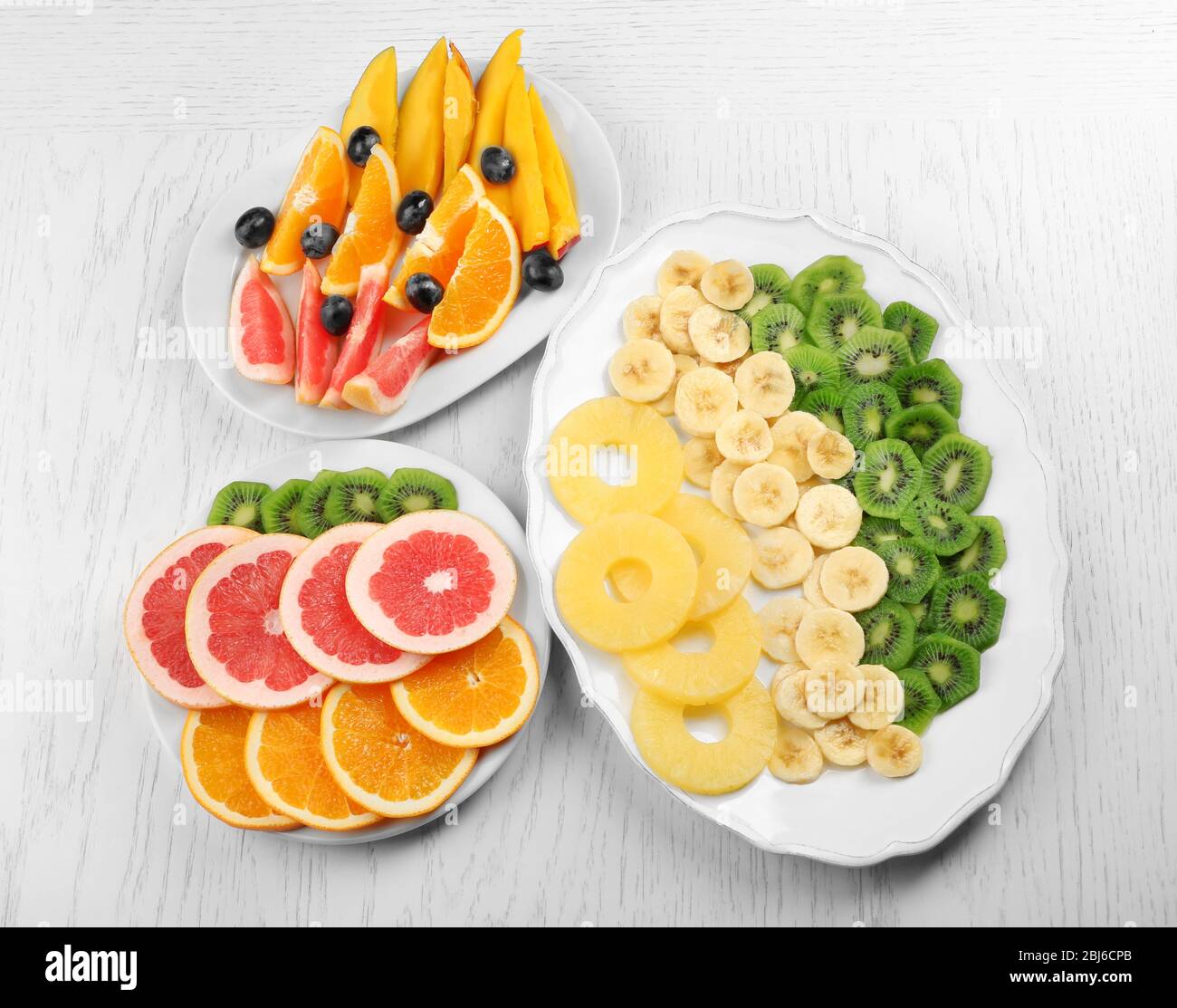Fruits and vegetables on light wooden background. healthy eating concept. Stock Photo
