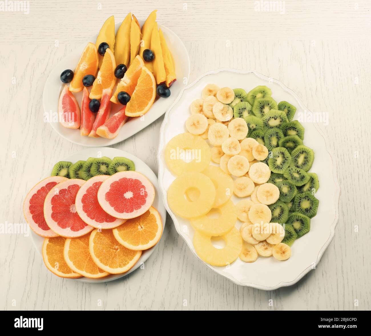 Fruits and vegetables on light wooden background. healthy eating concept. Stock Photo